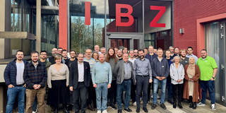 Participants in front of the entrance to the IBZ conference center.