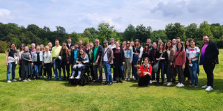 Group photo of the zhb team at the soccer golf course
